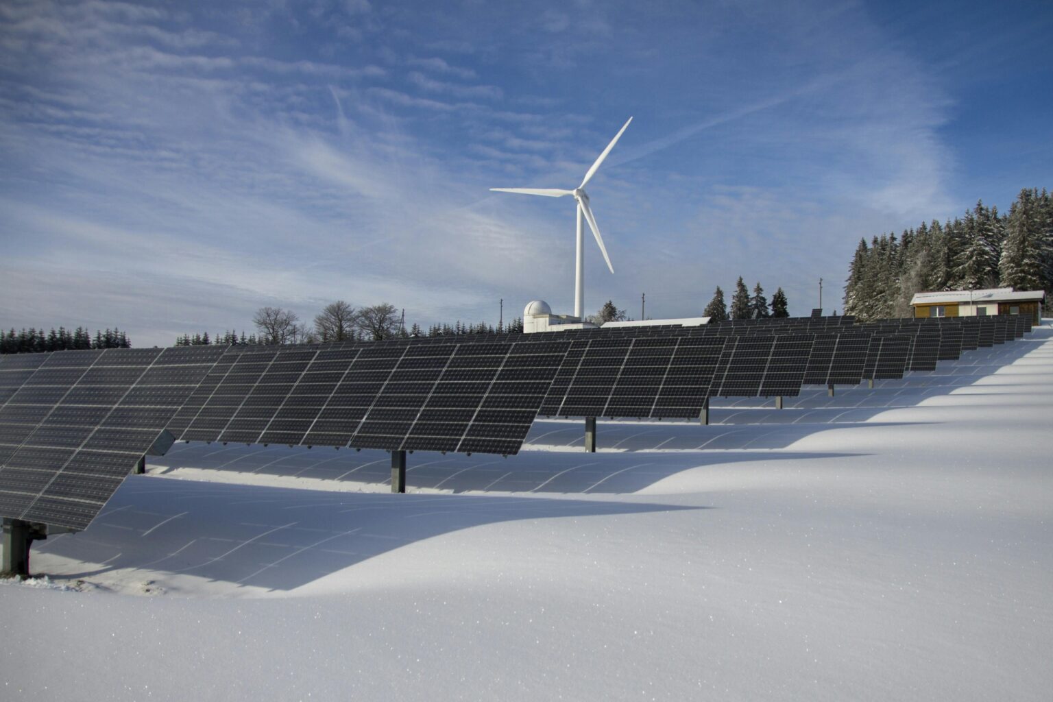Wind turbines and solar panels integrated in a high-altitude landscape