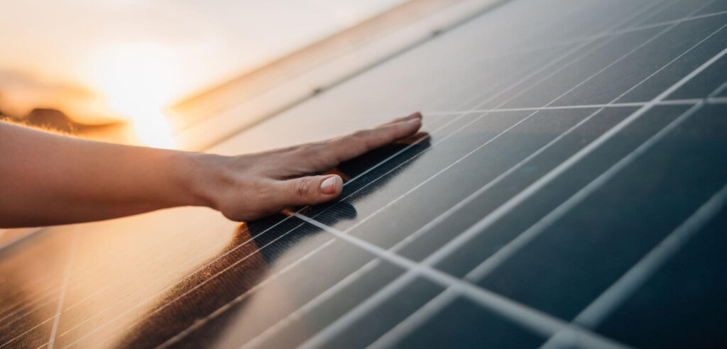 Bright sun shining over a modern solar panel installation